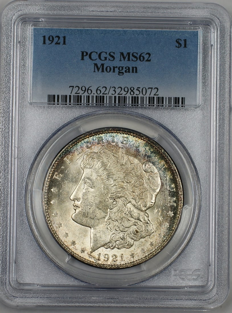 PCGS MS-62 1921 Silver Morgan Dollar Philadelphia Toned Rim: PCGS MS-62 1921 Silver Morgan Dollar Philadelphia Toned Rim This 1921 Morgan Silver Dollar is an uncirculated $1 coin graded MS-62 by PCGS. Featuring a toned rim, this coin was minted in Philadelphia 