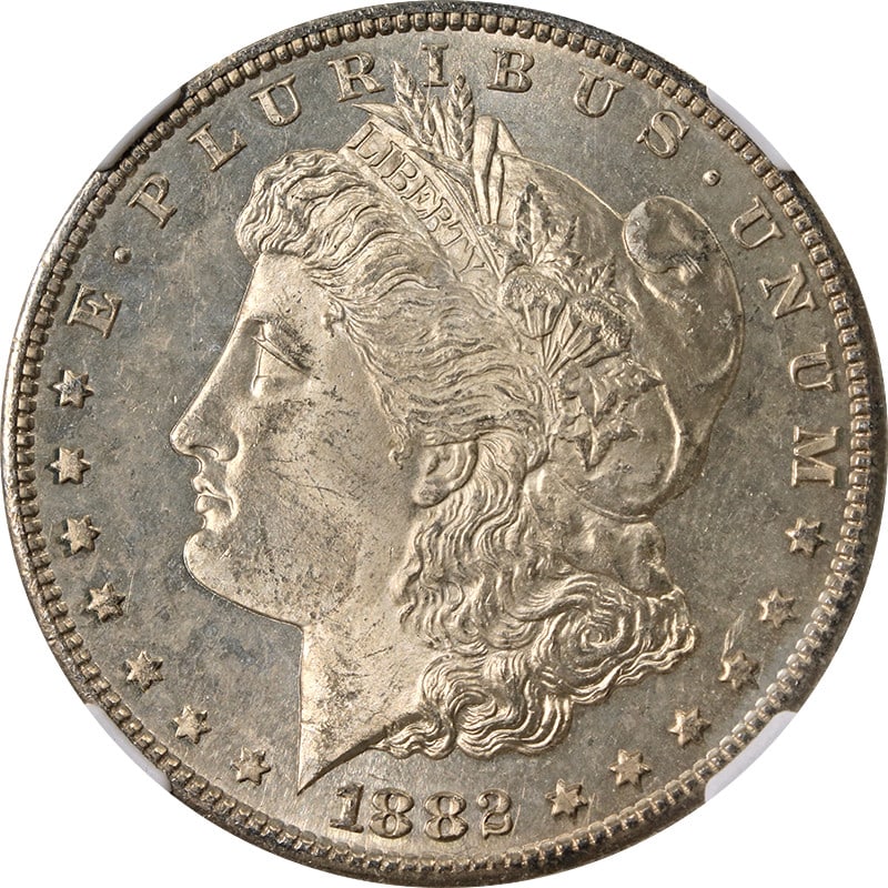 NGC MS64 1882-S Silver Morgan Dollar with Attractive Toning: NGC MS64 1882-S Silver Morgan Dollar with Attractive Toning This 1882-S Morgan Silver Dollar is graded MS64 by NGC and features attractive natural toning. Struck at the San Francisco Mint, the coin is