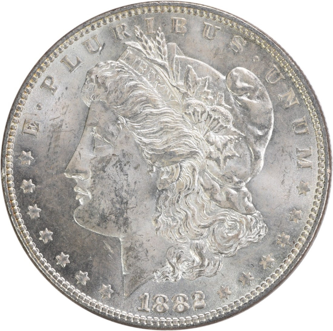 1882 $1 Morgan Silver Dollar BU Uncirculated Uncertified: 1882 $1 Morgan Silver Dollar BU Uncirculated Uncertified An 1882 Morgan Silver Dollar in BU condition. This uncirculated, uncertified coin is composed of silver and has no mint mark. It is a United St