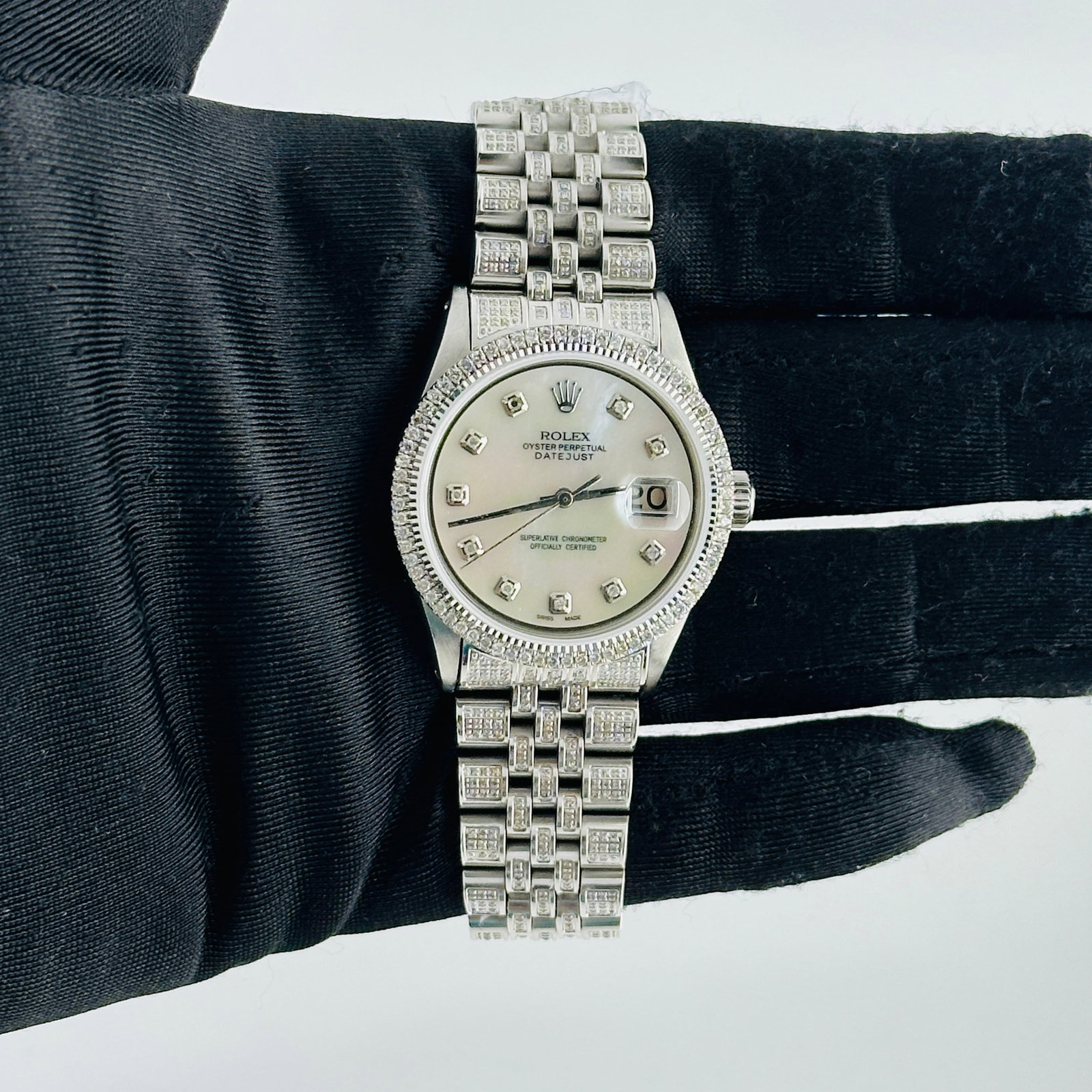 Rolex Datejust Ref 1601 Men's Watch With Aftermarket Diamond MOP Dial and Iced Out Jubilee: Rolex Datejust Ref 1601 Men's Watch With Aftermarket Diamond MOP Dial and Iced Out Jubilee This is a men's Rolex Datejust watch, reference number 1601. It features an aftermarket white mother of pearl