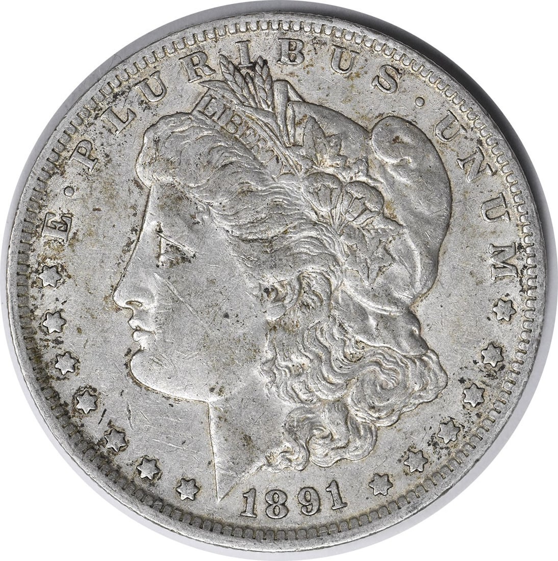 1891-O Morgan Dollar 90 Percent Silver Extra Fine Uncertified US Coin: 1891-O Morgan Dollar 90 Percent Silver Extra Fine Uncertified US Coin This 1891-O Morgan Silver Dollar features a composition of 90% silver and 10% copper. Minted in New Orleans, it is a circulated co