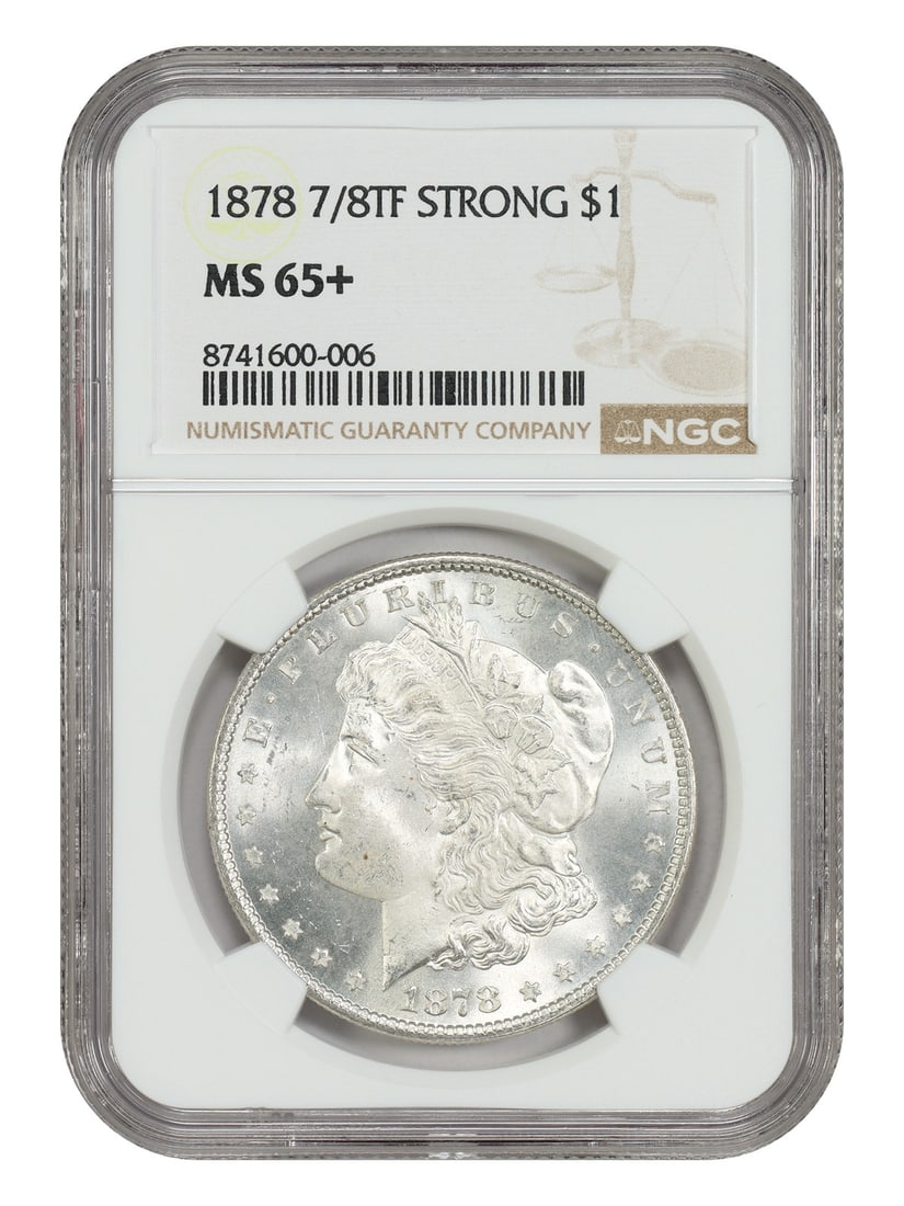 NGC MS65+ 1878 Morgan Dollar 7 8 Tailfeathers Strong Variety: NGC MS65+ 1878 Morgan Dollar 7 8 Tailfeathers Strong Variety 1878 7/8TF Morgan Dollar, graded MS65+ by NGC. This desirable variety features bold underlying tailfeathers on the eagle and is described a
