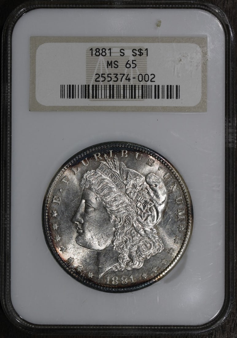 NGC MS65 1881-S Morgan $1 Silver Dollar Old Fatty Holder: NGC MS65 1881-S Morgan $1 Silver Dollar Old Fatty Holder An 1881-S Morgan Silver Dollar graded MS 65 by NGC and housed in a Fatty Old Holder. The coin is uncirculated, composed of silver, and originat