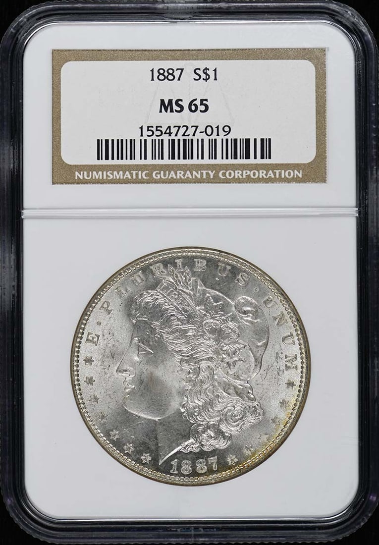 NGC MS65 1887 Morgan Silver Dollar: NGC MS65 1887 Morgan Silver Dollar This 1887 Morgan Dollar is certified by NGC with a grade of MS65, indicating a high-quality, uncirculated coin. Minted in Philadelphia, it features the classic Morga