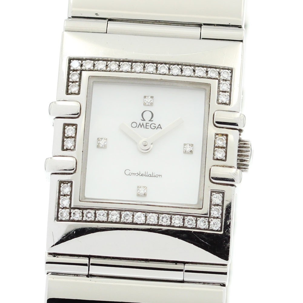 Omega Constellation Carre ladies quartz watch diamond bezel: Omega Constellation Carre ladies quartz watch diamond bezel This Omega Constellation Carre wristwatch features a stainless steel case and bracelet, accented by a diamond bezel and four diamond markers