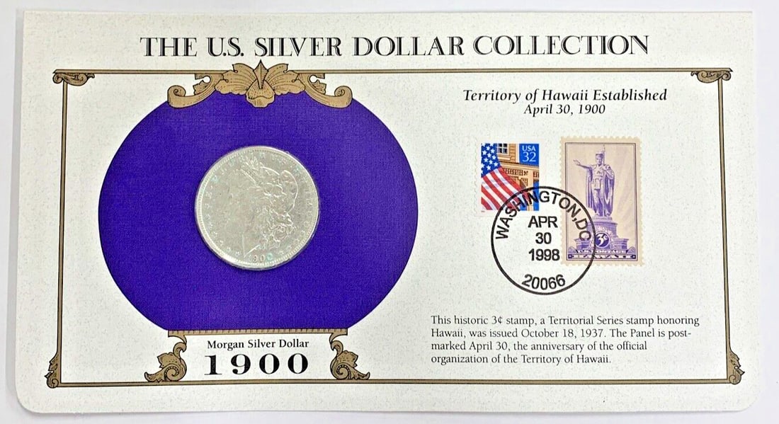 1900-O Morgan Dollar Silver Coin with Commemorative Stamp Card: 1900-O Morgan Dollar Silver Coin with Commemorative Stamp Card This 1900-O Morgan Silver Dollar is a $1 coin from the United States, minted in New Orleans. The coin is circulated and ungraded, with no