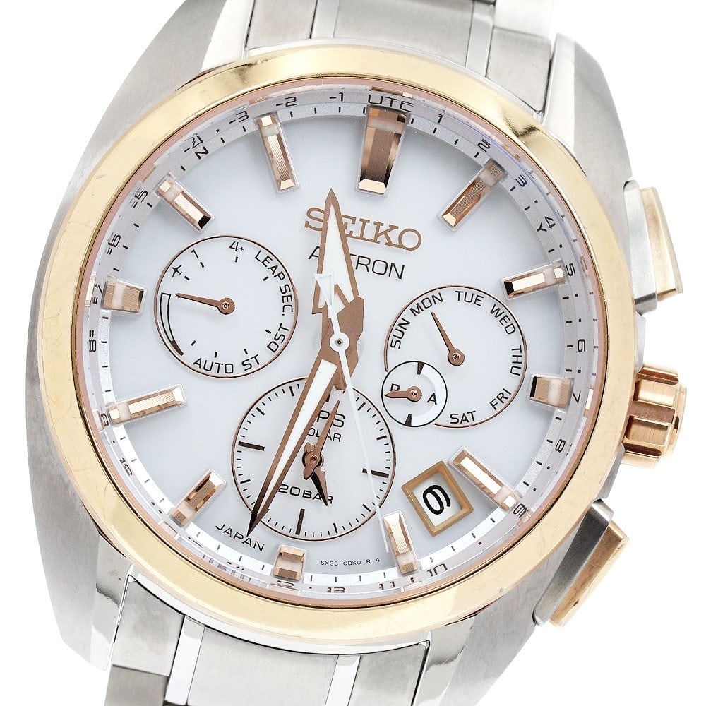 SEIKO Astron Titanium GPS Solar Men's Wristwatch SBXC104: SEIKO Astron Titanium GPS Solar Men's Wristwatch SBXC104 This Seiko Astron SBXC104/5X53-0AV0 is a men's wristwatch featuring a titanium case with gold plating and a white dial. The watch is powered by