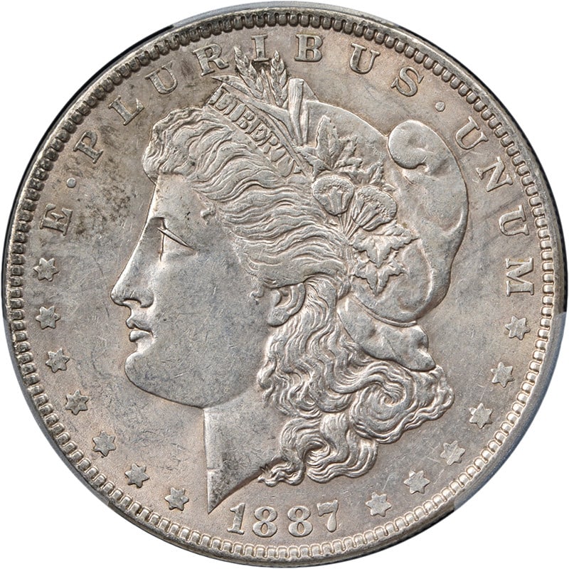PCGS AU Details 1887 6 Overdate Morgan Silver Dollar: PCGS AU Details 1887 6 Overdate Morgan Silver Dollar 1887/6-P Morgan Silver Dollar certified by PCGS with an AU Details grade. The coin is composed of silver and is identified as a circulated piece fr