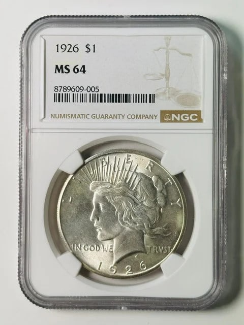 NGC MS-64 1926 Peace Silver Dollar: NGC MS-64 1926 Peace Silver Dollar This 1926 Peace Dollar is certified by NGC with a grade of MS 64, indicating a high-quality, well-preserved coin. Struck in silver, it features the classic Peace Dol