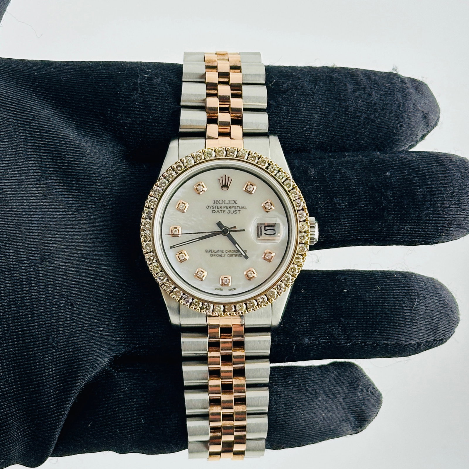 Rolex Datejust 1601 White MOP Dial Rose Diamond Markers Jubilee Bracelet: Rolex Datejust 1601 White MOP Dial Rose Diamond Markers Jubilee Bracelet This men's Rolex Datejust features an aftermarket white mother-of-pearl dial with rose diamond markers, paired with an aftermar