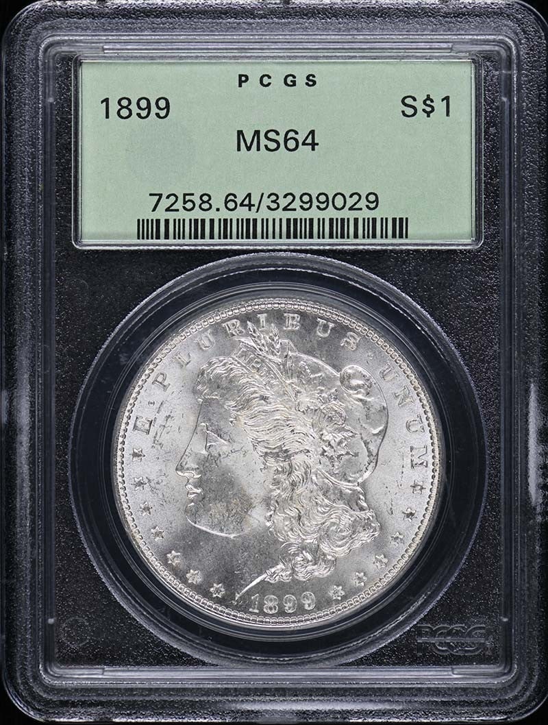 PCGS MS64 1899 Morgan Silver Dollar: PCGS MS64 1899 Morgan Silver Dollar This 1899 Morgan Dollar is certified by PCGS with a grade of MS64, indicating a well-preserved, uncirculated coin. Minted in Philadelphia, it features the classic M