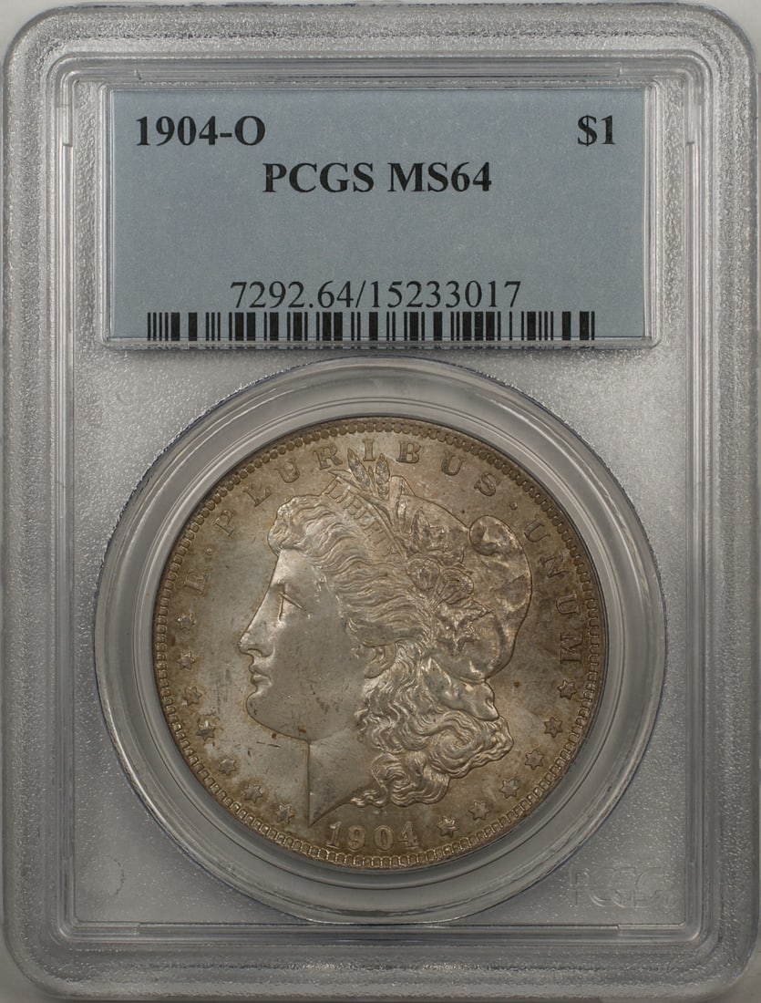 PCGS MS-64 Morgan Dollar 1904 New Orleans Mint Silver $1 Coin: PCGS MS-64 Morgan Dollar 1904 New Orleans Mint Silver $1 Coin This is a 1904-O Morgan Silver Dollar $1 coin minted in New Orleans. Graded MS-64 by PCGS, the coin is uncirculated and features a toned f