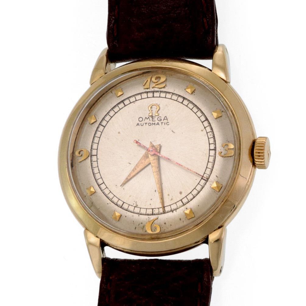 Vintage Omega 14k Yellow Gold Automatic Men's Watch with Leather Band: Vintage Omega 14k Yellow Gold Automatic Men's Watch with Leather Band Discover a stunning vintage Omega men's wristwatch that combines elegance and precision. This authentic timepiece features a case 