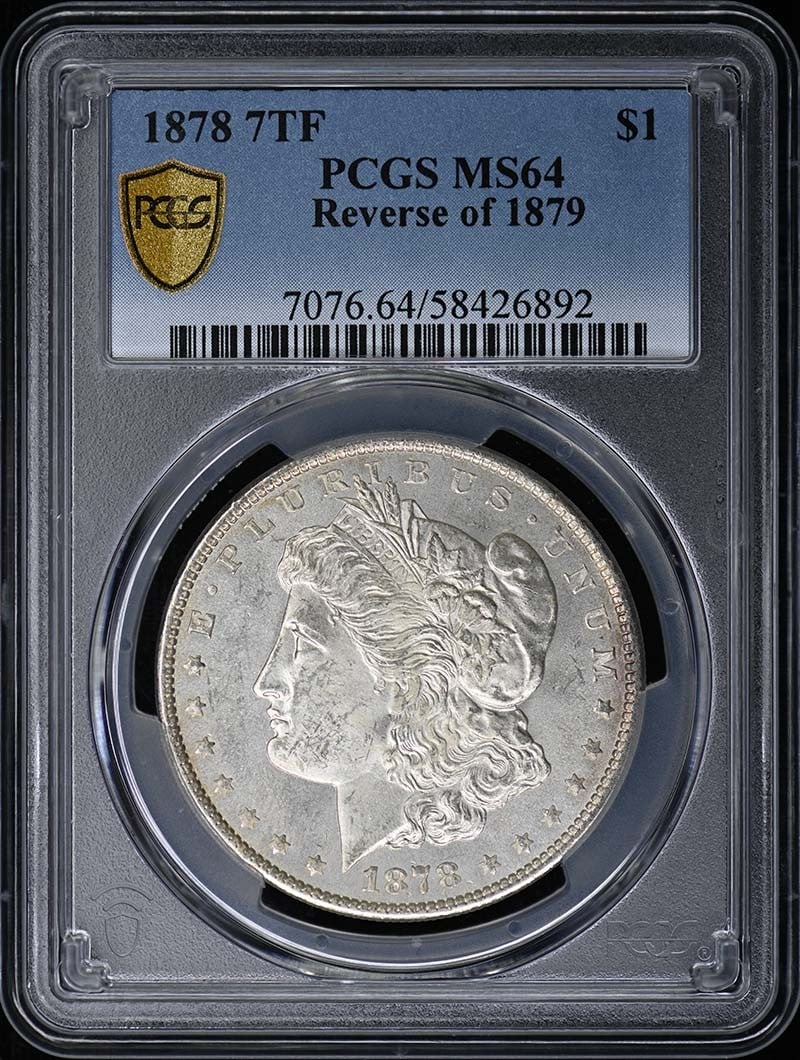PCGS MS64 Morgan Dollar 1878 7 Tail Feathers Reverse 1879 Philadelphia: PCGS MS64 Morgan Dollar 1878 7 Tail Feathers Reverse 1879 Philadelphia This is an uncirculated 1878 7 Tail Feathers Morgan Dollar, Reverse of 1879, graded MS64 by PCGS. Minted in Philadelphia, this pr