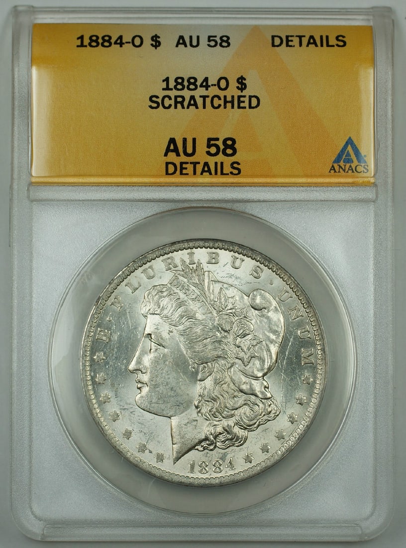 ANACS AU 58 Details 1884-O Silver Dollar with Scratch New Orleans Mint: ANACS AU 58 Details 1884-O Silver Dollar with Scratch New Orleans Mint This 1884-O Morgan Silver Dollar was minted in New Orleans and is composed of silver. Certified by ANACS with a grade of AU 58 De