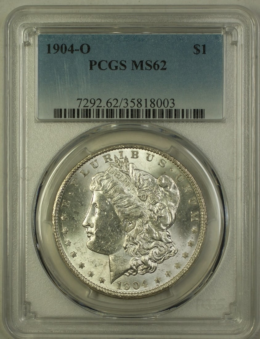 PCGS MS 62 1904-O Morgan Dollar Silver Coin from New Orleans Mint: PCGS MS 62 1904-O Morgan Dollar Silver Coin from New Orleans Mint This is a 1904-O Morgan Silver Dollar $1 coin from the United States, certified by PCGS with a grade of MS 62. Minted in New Orleans, 