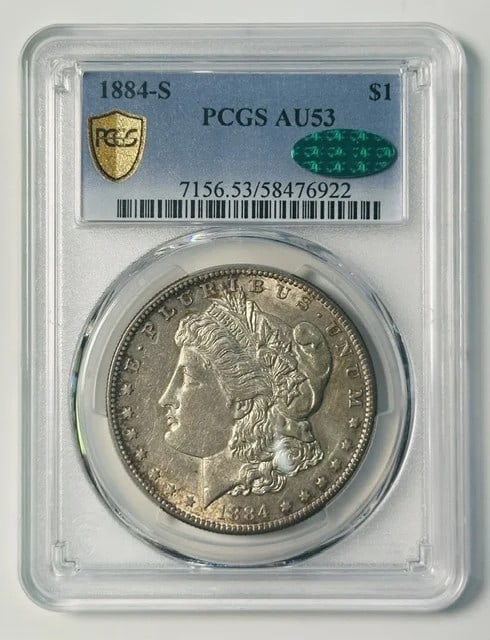 1884-S Morgan Silver Dollar PCGS AU53 CAC: 1884-S Morgan Silver Dollar PCGS AU53 CAC This 1884 Morgan Silver Dollar was minted in San Francisco and is graded AU-53 by PCGS. The coin has also received CAC approval, indicating quality within its