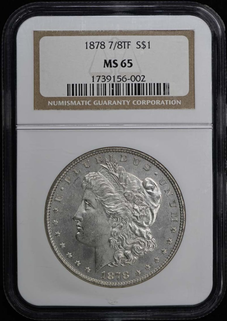 1878 Morgan Silver Dollar 7/8 Tail Feathers NGC MS65 Uncirculated: 1878 Morgan Silver Dollar 7/8 Tail Feathers NGC MS65 Uncirculated This is an uncirculated 1878 7/8 Tail Feathers Strong Morgan Dollar, certified by NGC with a grade of MS65. Minted in Philadelphia, th