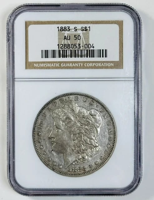 San Francisco 1883 Morgan Dollar NGC AU 50 Silver: San Francisco 1883 Morgan Dollar NGC AU 50 Silver This 1883 Morgan Silver Dollar was struck at the San Francisco Mint and is graded AU-50 by NGC. Composed of silver, this pre-owned coin is a collectib