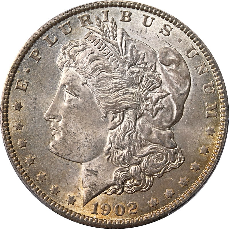PCGS MS63 1902-O Morgan Dollar With Attractive Toning: PCGS MS63 1902-O Morgan Dollar With Attractive Toning This 1902-O Morgan Silver Dollar is certified by PCGS with a grade of MS63 and features attractive toning. The coin is uncirculated and composed o