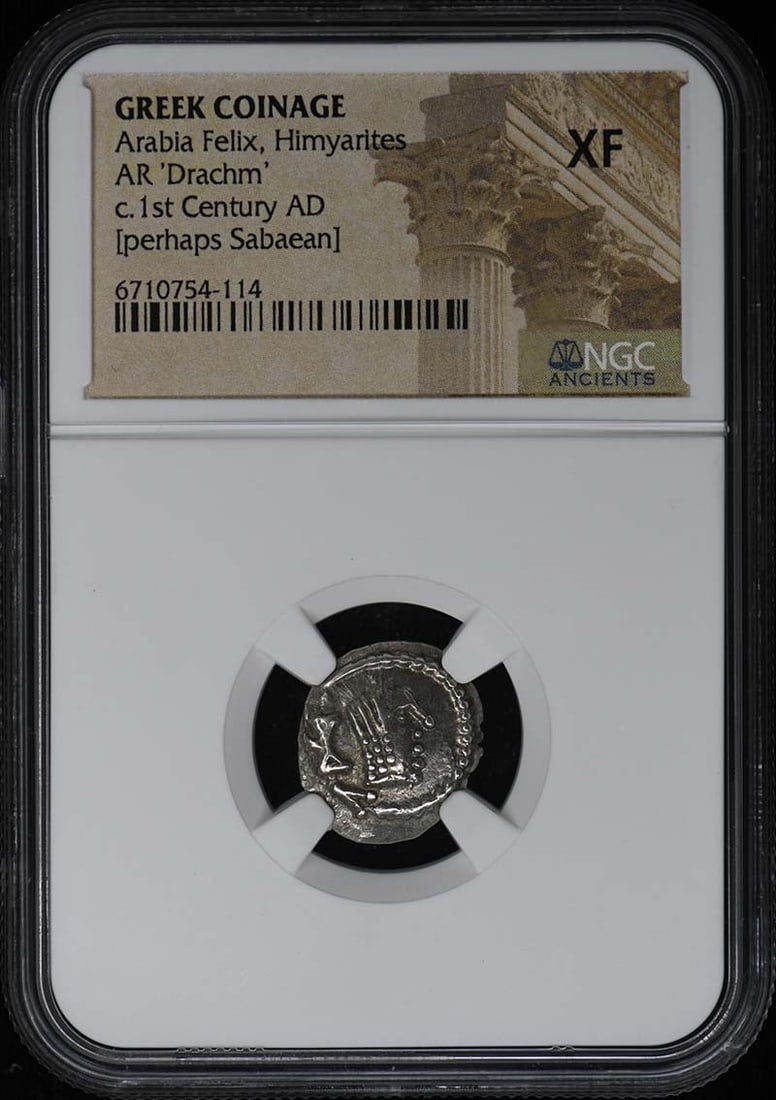 NGC XF Himyarite Greek Drachm Coin: NGC XF Himyarite Greek Drachm Coin This is an Arabia Felix Himyarites AR 'Drachm' coin, part of the Greek coinage series. The coin has been certified by NGC and graded as XF (Extremely Fine), indicati