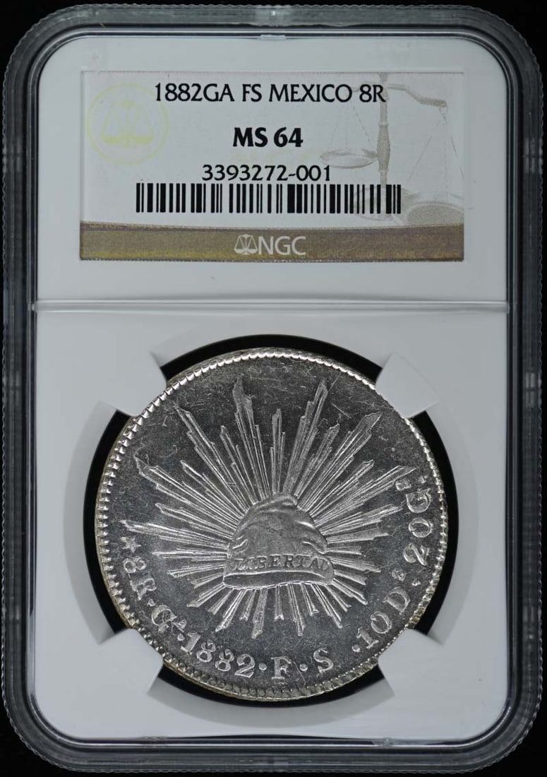 1882 Mexico 8 Real Silver Coin NGC MS64 Uncirculated: 1882 Mexico 8 Real Silver Coin NGC MS64 Uncirculated This 1882 Mexico 8 Reales coin is in uncirculated condition and has been certified by NGC with a grade of MS64. The coin boasts a rich history, mak