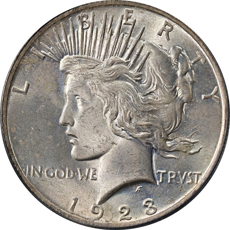 PCGS MS63 1923 Peace Silver Dollar With Toning: PCGS MS63 1923 Peace Silver Dollar With Toning This 1923-P Peace Dollar is graded MS63 by PCGS and features attractive toning. Minted in Philadelphia, it is composed of 90% silver and remains in uncir