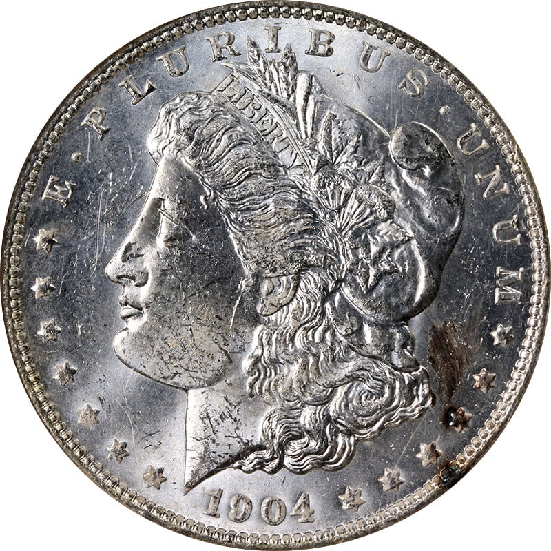 NGC MS63 1904-O Morgan Dollar Uncirculated Silver Coin Minimal Toning: NGC MS63 1904-O Morgan Dollar Uncirculated Silver Coin Minimal Toning This 1904-O Morgan Silver Dollar is graded MS63 by NGC and features minimal toning. Struck at the New Orleans Mint, this uncircula