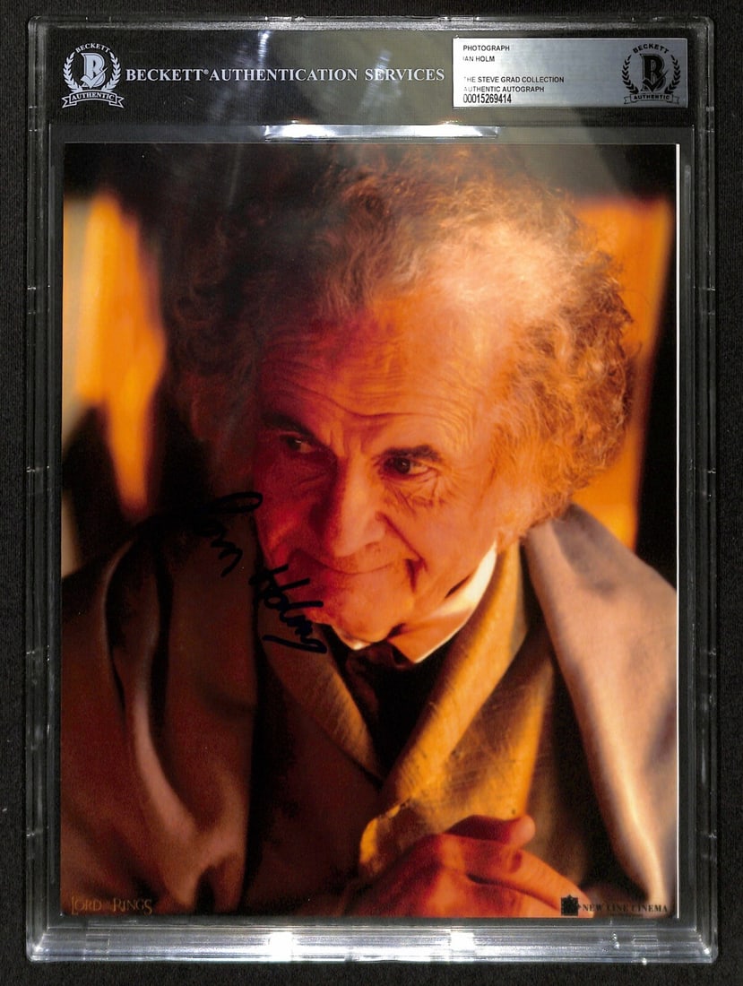 Ian Holm Signed 8x10 Bilbo Baggins Photo Beckett Authenticated: Ian Holm Signed 8x10 Bilbo Baggins Photo Beckett Authenticated This stunning 8x10 color photograph features Ian Holm, renowned for his role as Bilbo Baggins in The Lord of the Rings, who has signed it