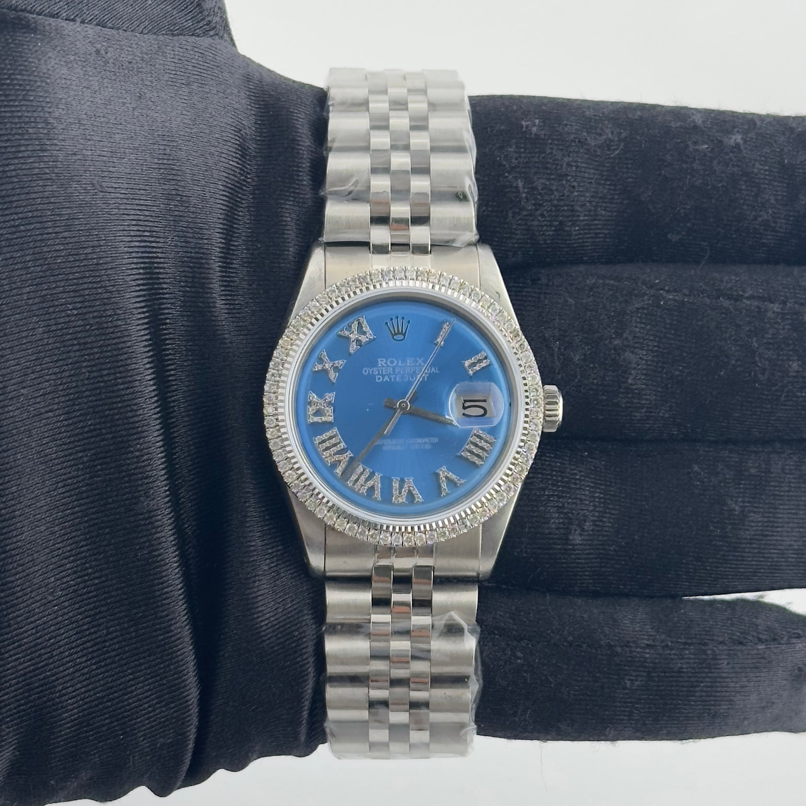 Rolex Mens Datejust 1601 Watch with Aftermarket Blue Roman Dial and Jubilee Bracelet: Rolex Mens Datejust 1601 Watch with Aftermarket Blue Roman Dial and Jubilee Bracelet This Rolex Datejust features an aftermarket blue Roman dial and is equipped with an aftermarket Jubilee bracelet. T