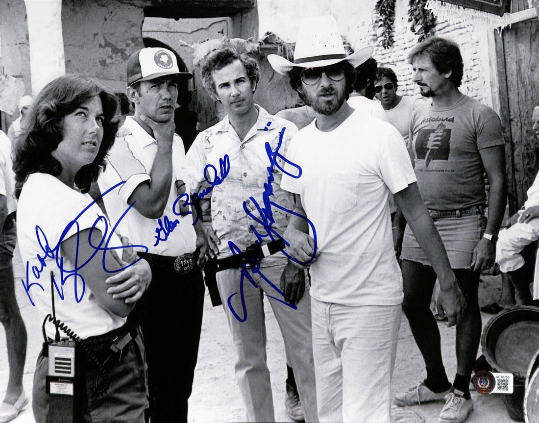 Indiana Jones Multi-Signed 11x14 Photo by Kennedy Kazanjian Randall BECKETT Authenticated: Indiana Jones Multi-Signed 11x14 Photo by Kennedy Kazanjian Randall BECKETT Authenticated This rare 11x14 black & white matte finish photograph captures a behind-the-scenes moment during the filming o