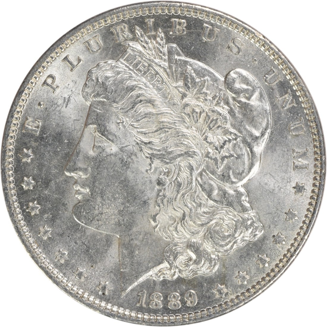 Choice BU 1889 Silver Dollar Morgan Uncirculated Uncertified Coin: Choice BU 1889 Silver Dollar Morgan Uncirculated Uncertified Coin This 1889 Morgan Silver Dollar is a Choice Brilliant Uncirculated example. Struck in silver, it features no mint mark and remains unce