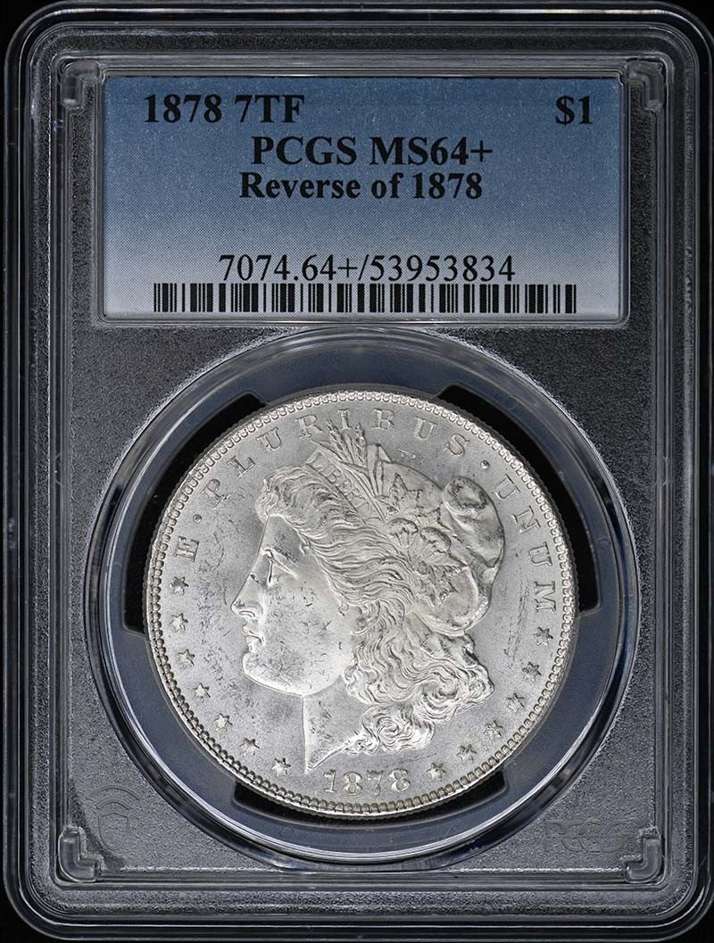 1878 7TF Morgan Dollar Reverse PCGS MS64+: 1878 7TF Morgan Dollar Reverse PCGS MS64+ This is a 1878 Morgan Dollar featuring the 7 Tail Feathers (7TF) design with the Reverse of 1878. Graded MS64+ by PCGS, this uncirculated coin was minted in P