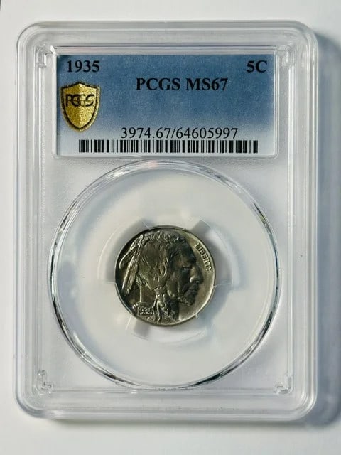 1935 Philadelphia Buffalo Nickel PCGS MS-67: 1935 Philadelphia Buffalo Nickel PCGS MS-67 This 1935 Buffalo Nickel was minted in Philadelphia and has been graded MS-67 by PCGS. It is composed of nickel and has a denomination of 5 cents. The coin 