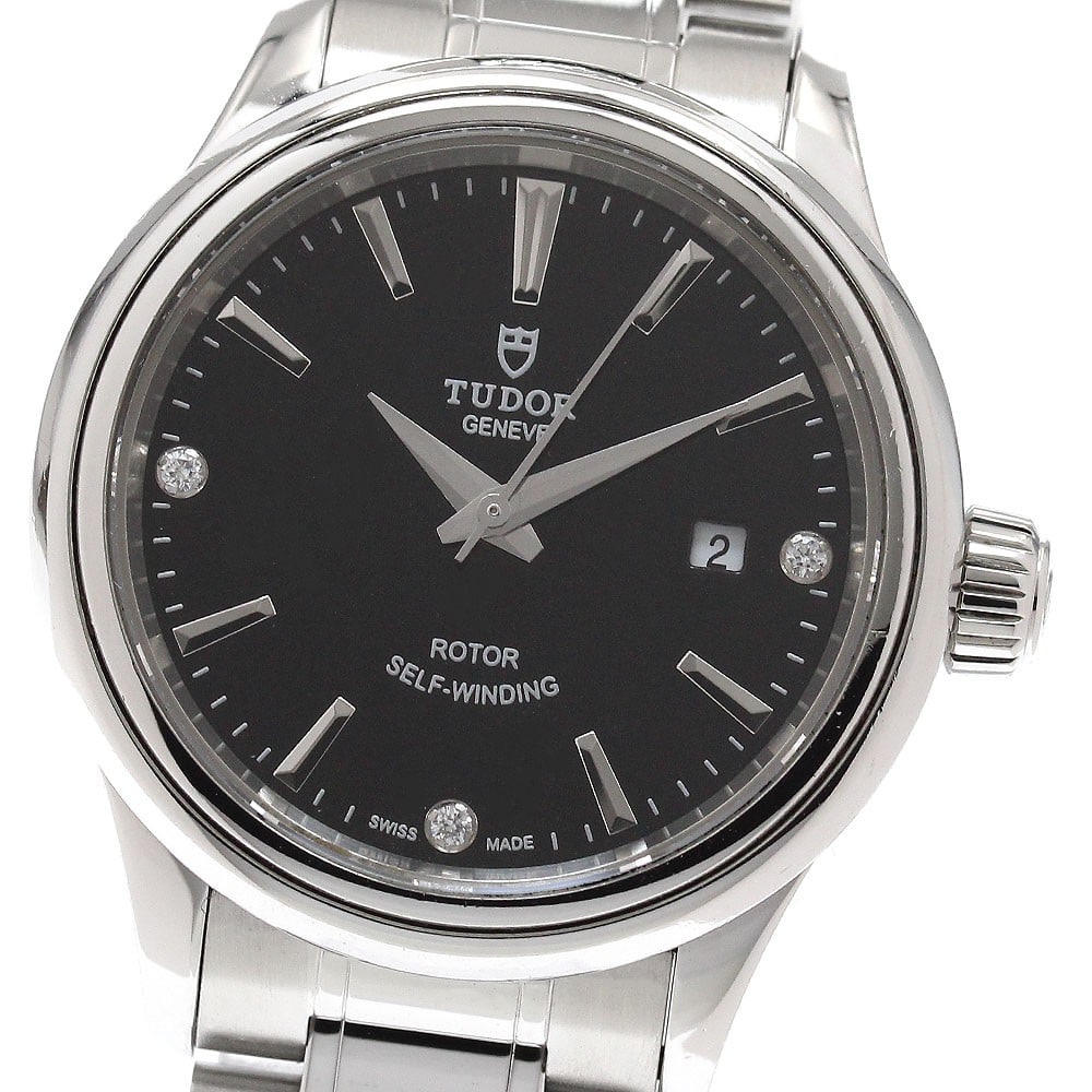 TUDOR Style 12100 Automatic Date Women's Wristwatch: TUDOR Style 12100 Automatic Date Women's Wristwatch This Tudor Style 12100 women's automatic wristwatch features a stainless steel case and bracelet with a black dial accented by three diamond hour ma