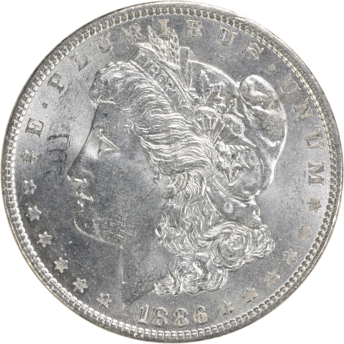 Choice BU 1886 Morgan Silver Dollar Uncirculated Uncertified US Coin: Choice BU 1886 Morgan Silver Dollar Uncirculated Uncertified US Coin This is an 1886 Morgan Silver Dollar from the United States, featuring a Choice Brilliant Uncirculated (BU) grade. Struck with no m