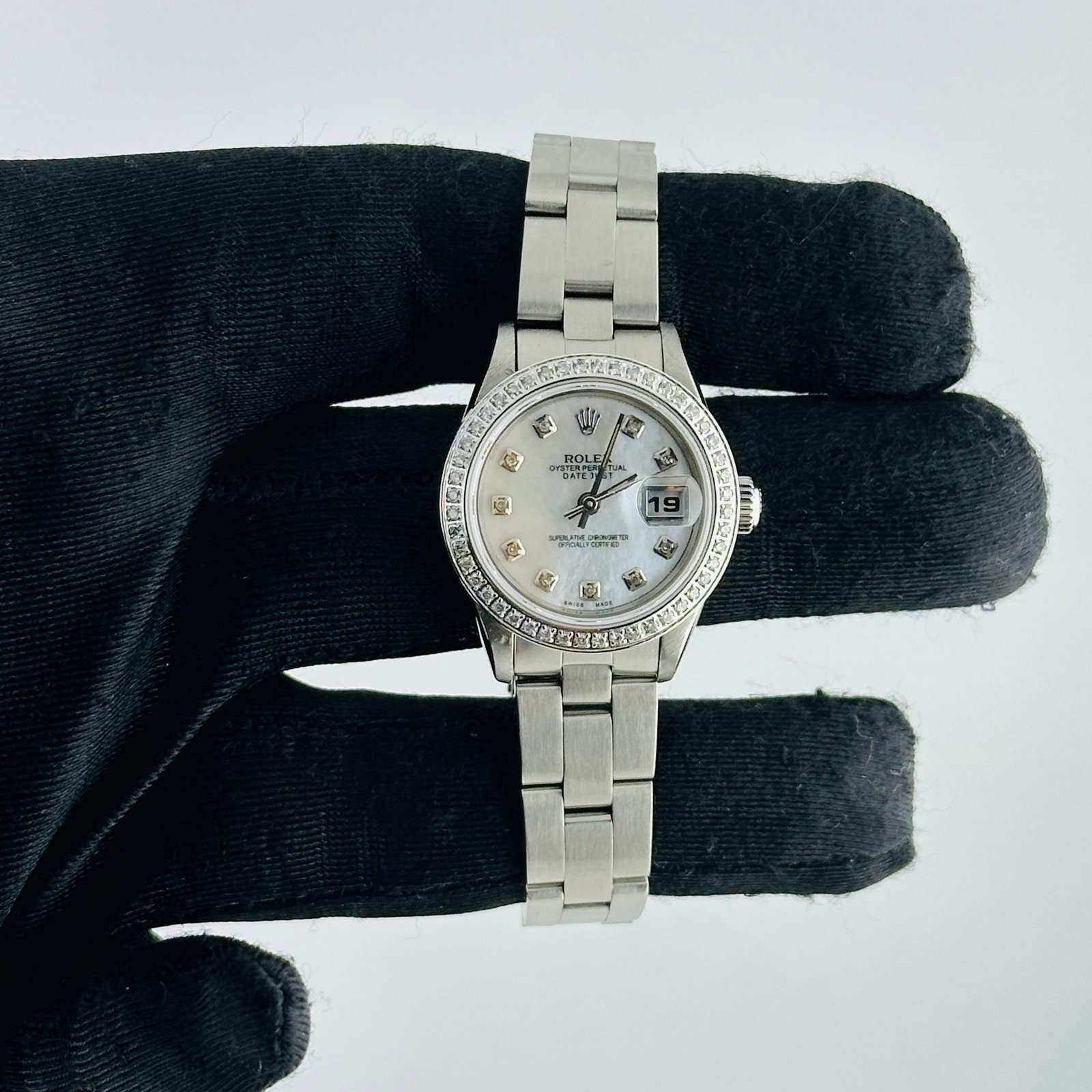 Rolex Ladies Datejust Ref 69190 White MOP Diamond Dial Oyster Bracelet AM: Rolex Ladies Datejust Ref 69190 White MOP Diamond Dial Oyster Bracelet AM This ladies Rolex Datejust features an after-market white mother of pearl dial set with diamond hour markers and a pave diamon