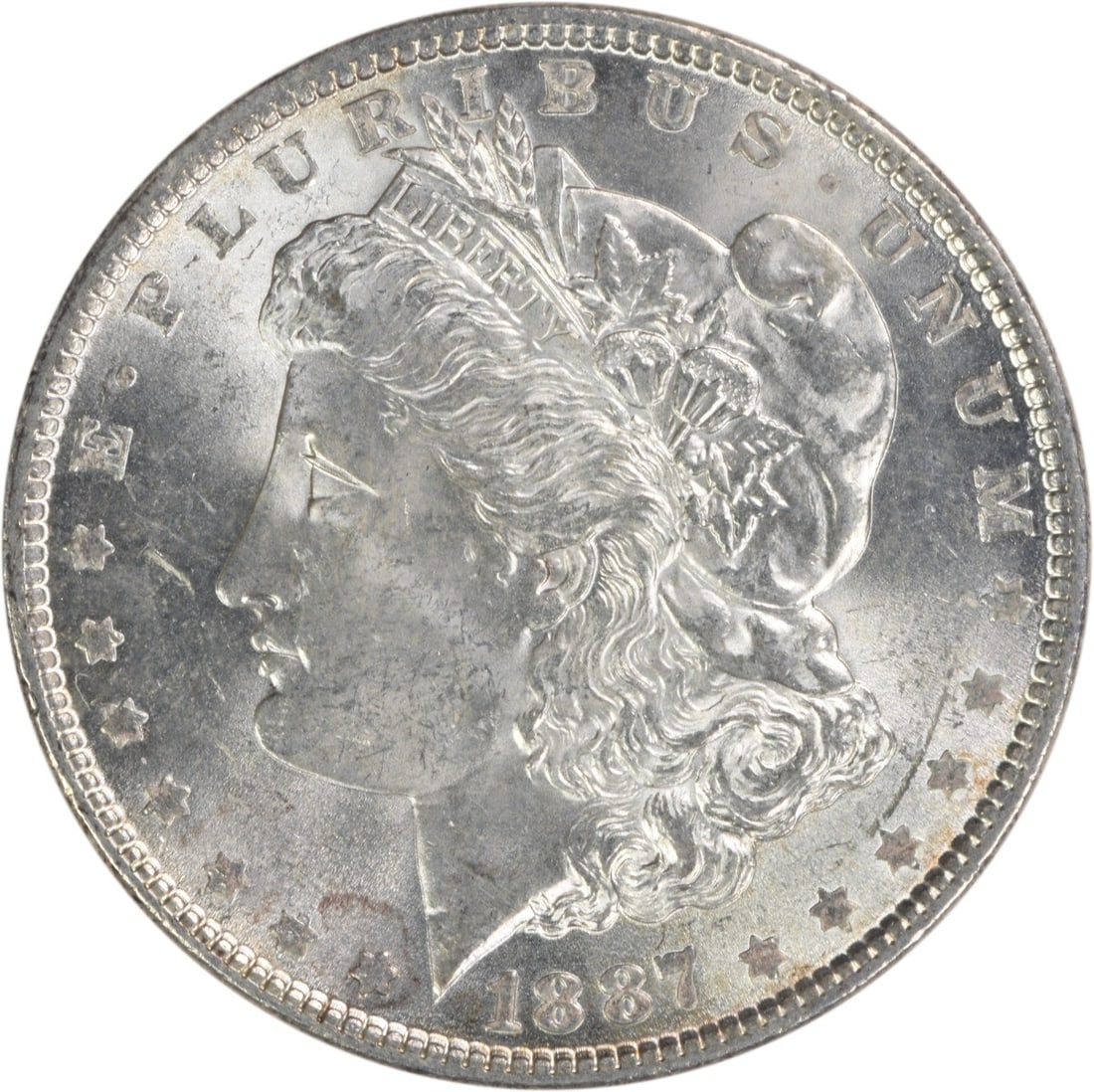 Choice BU 1887 Silver Dollar Morgan Uncirculated Philadelphia Issue: Choice BU 1887 Silver Dollar Morgan Uncirculated Philadelphia Issue This is an 1887 Morgan Silver Dollar from the United States, featuring a Choice Brilliant Uncirculated (BU) grade. The coin is compo
