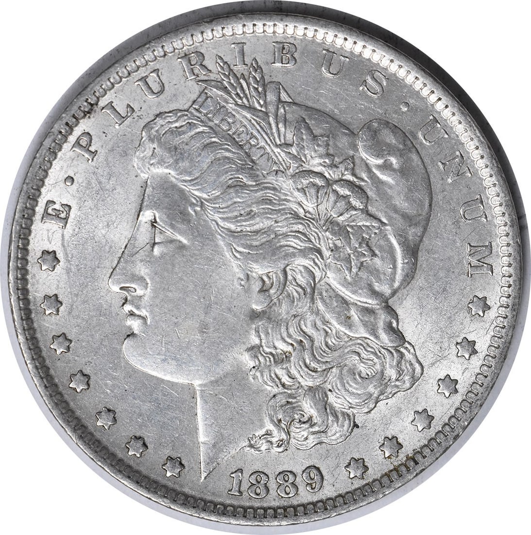 1889-O Morgan Silver Dollar AU Uncertified Coin by George T. Morgan: 1889-O Morgan Silver Dollar AU Uncertified Coin by George T. Morgan This 1889-O Morgan Silver Dollar features a stunning design by George T. Morgan, showcasing the classic profile of Lady Liberty on
