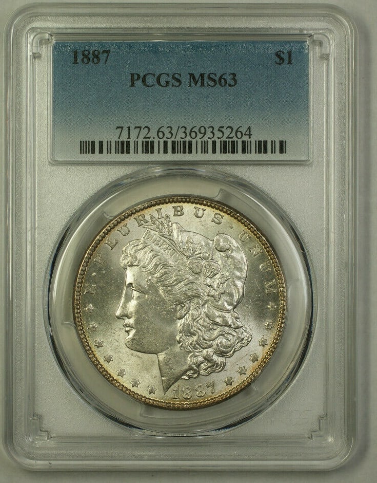 1887 Morgan Dollar Silver Coin PCGS MS63 Philadelphia Mint: 1887 Morgan Dollar Silver Coin PCGS MS63 Philadelphia Mint This is an 1887 Morgan Silver Dollar $1 coin, certified by PCGS with a grade of MS-63. The coin is uncirculated and composed of 0.9 fine silv