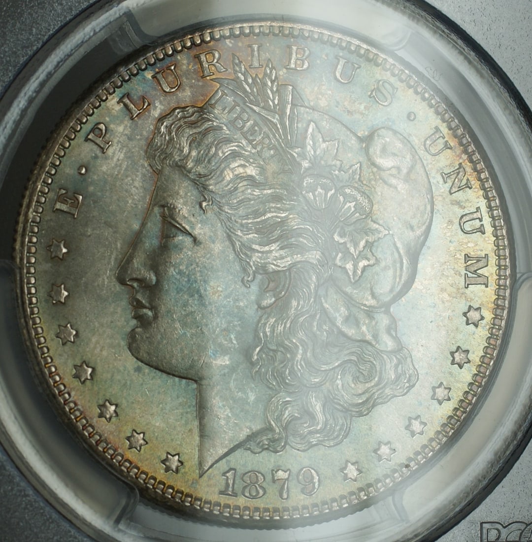 PCGS MS-64 1879-S Morgan silver dollar toned: PCGS MS-64 1879-S Morgan silver dollar toned This 1879-S Morgan Silver Dollar is graded MS-64 by PCGS and features attractive, multi-colored toning on the obverse. Struck in San Francisco, this uncirc
