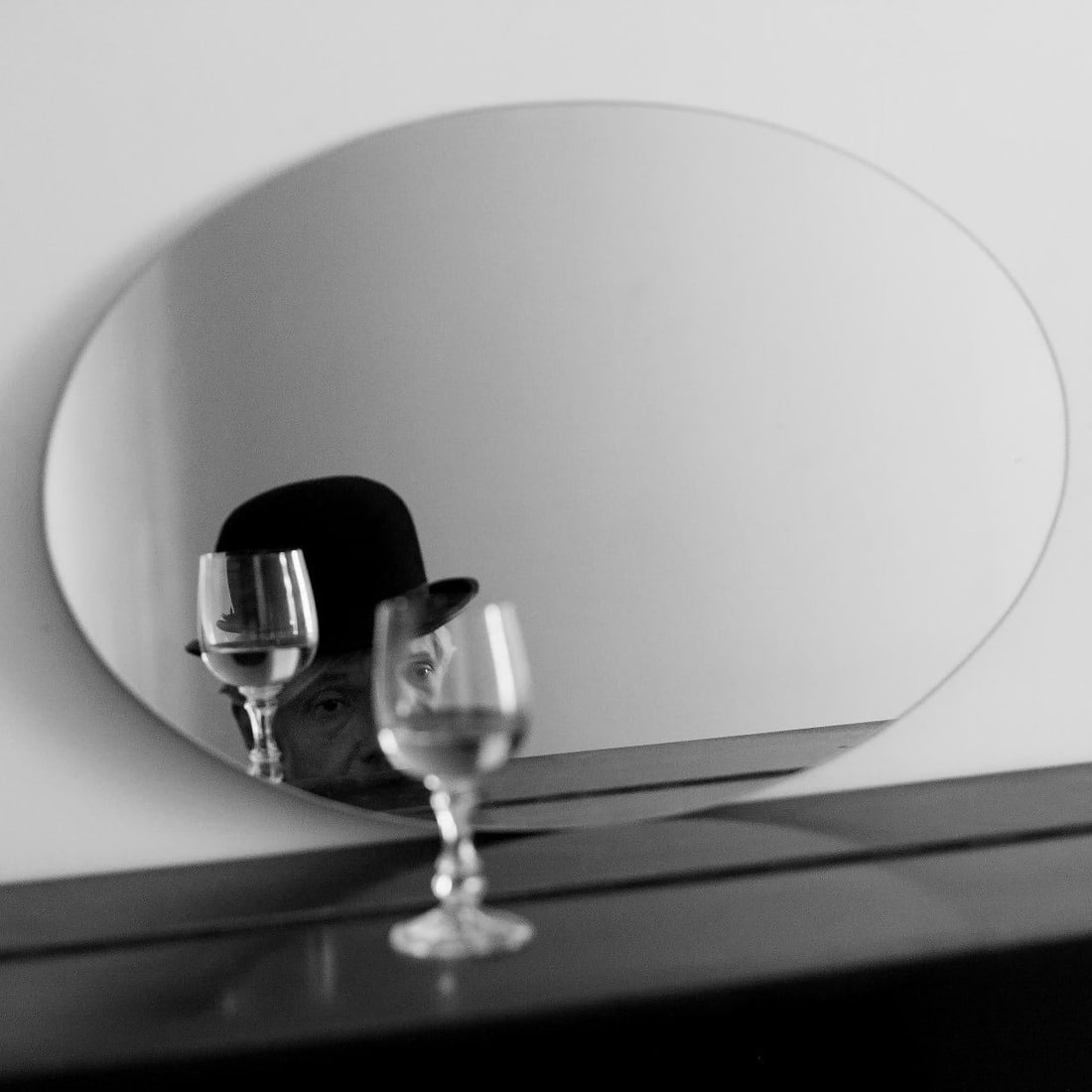 In the Mirror Black and White Photography Ed 1 of 15 by Olha Stepanian 24 x 24: In the Mirror Black and White Photography Ed 1 of 15 by Olha Stepanian 24 x 24 "In the Mirror" is a striking black and white photograph by Olha Stepanian, measuring 24" x 24". Created in 2018, this pi