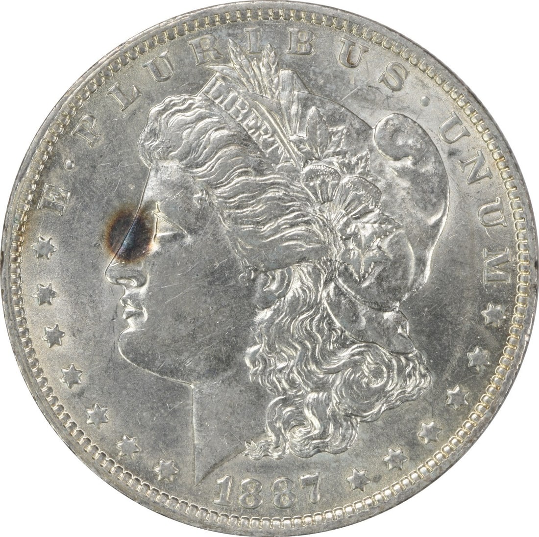 1887-O Morgan Silver Dollar AU Uncertified 90% Silver New Orleans: 1887-O Morgan Silver Dollar AU Uncertified 90% Silver New Orleans This 1887-O Morgan Silver Dollar features a striking design by George T. Morgan, showcasing the historical artistry and craftsmanship 