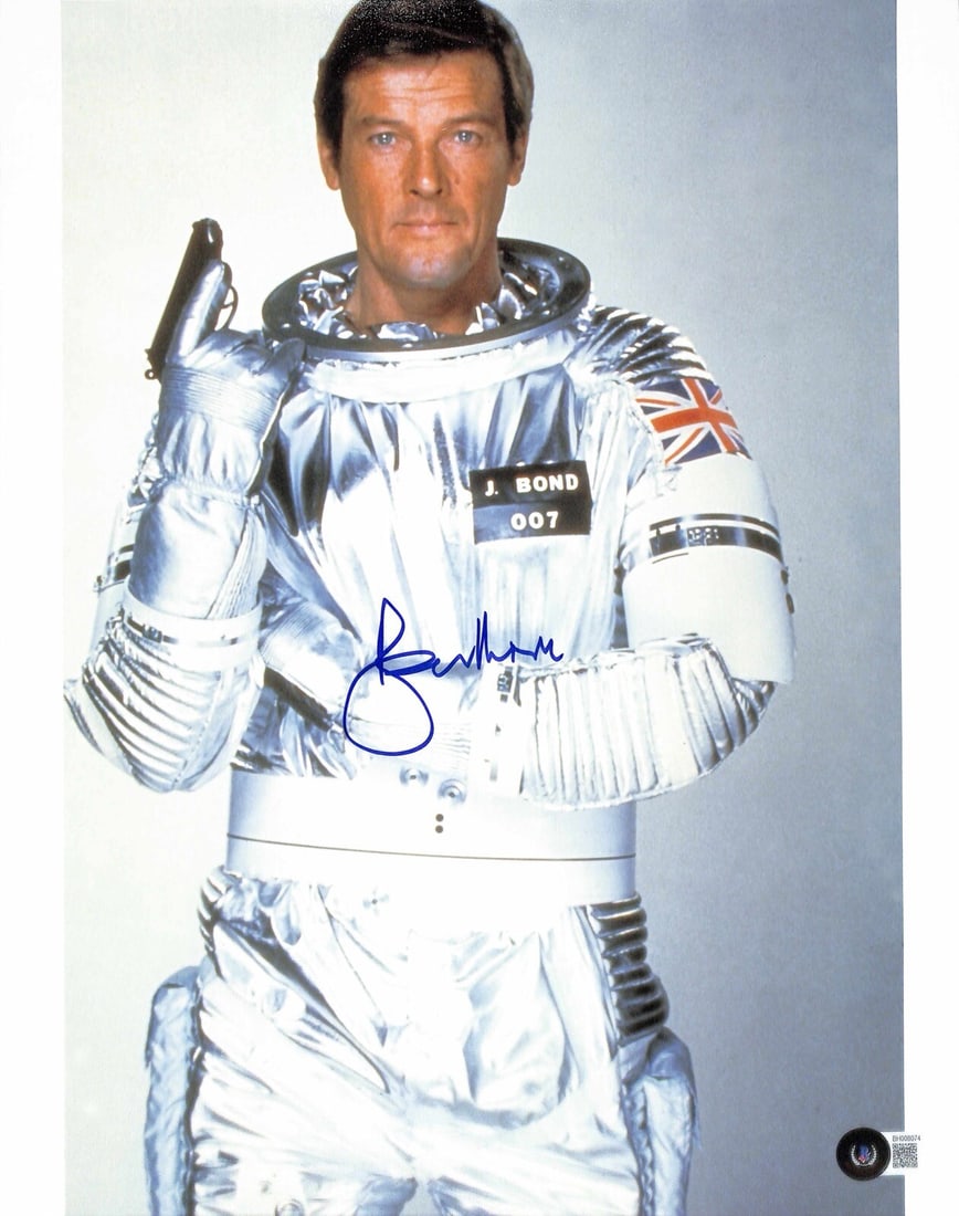 11x14 Photo Signed by Roger Moore as James Bond Moonraker Beckett Authenticated: 11x14 Photo Signed by Roger Moore as James Bond Moonraker Beckett Authenticated This 11x14 photograph from the film "Moonraker" features a blue permanent marker autograph by Roger Moore, who portrayed