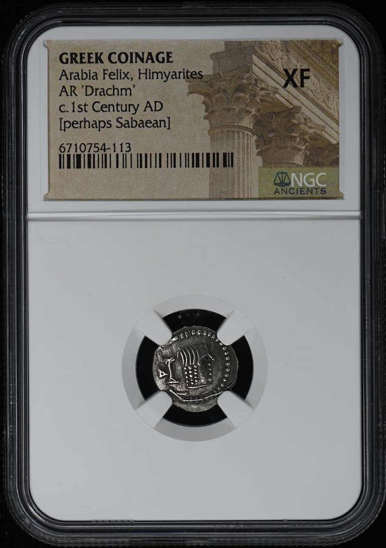 NGC XF Himyarite Greek Drachm Coin: NGC XF Himyarite Greek Drachm Coin This is an AR 'Drachm' coin from the Himyarites, Arabia Felix, featuring Greek coinage style. The coin is certified by NGC and graded XF, indicating it is in extra f