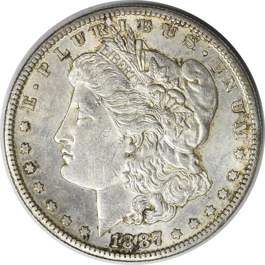 1887-S Morgan Silver Dollar AU Uncertified George T. Morgan Design: 1887-S Morgan Silver Dollar AU Uncertified George T. Morgan Design This 1887-S Morgan Silver Dollar is a remarkable piece of history, featuring a composition of 90% silver and 10% copper. Circulated b