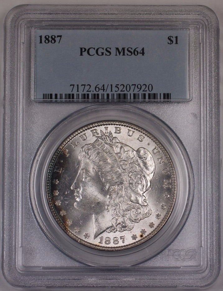1887 Morgan Dollar Silver $1 Coin PCGS MS64 Philadelphia Light Toning: 1887 Morgan Dollar Silver $1 Coin PCGS MS64 Philadelphia Light Toning This 1887 US Morgan Silver Dollar coin, minted in Philadelphia, is certified by PCGS with a grade of MS 64. The coin is composed o