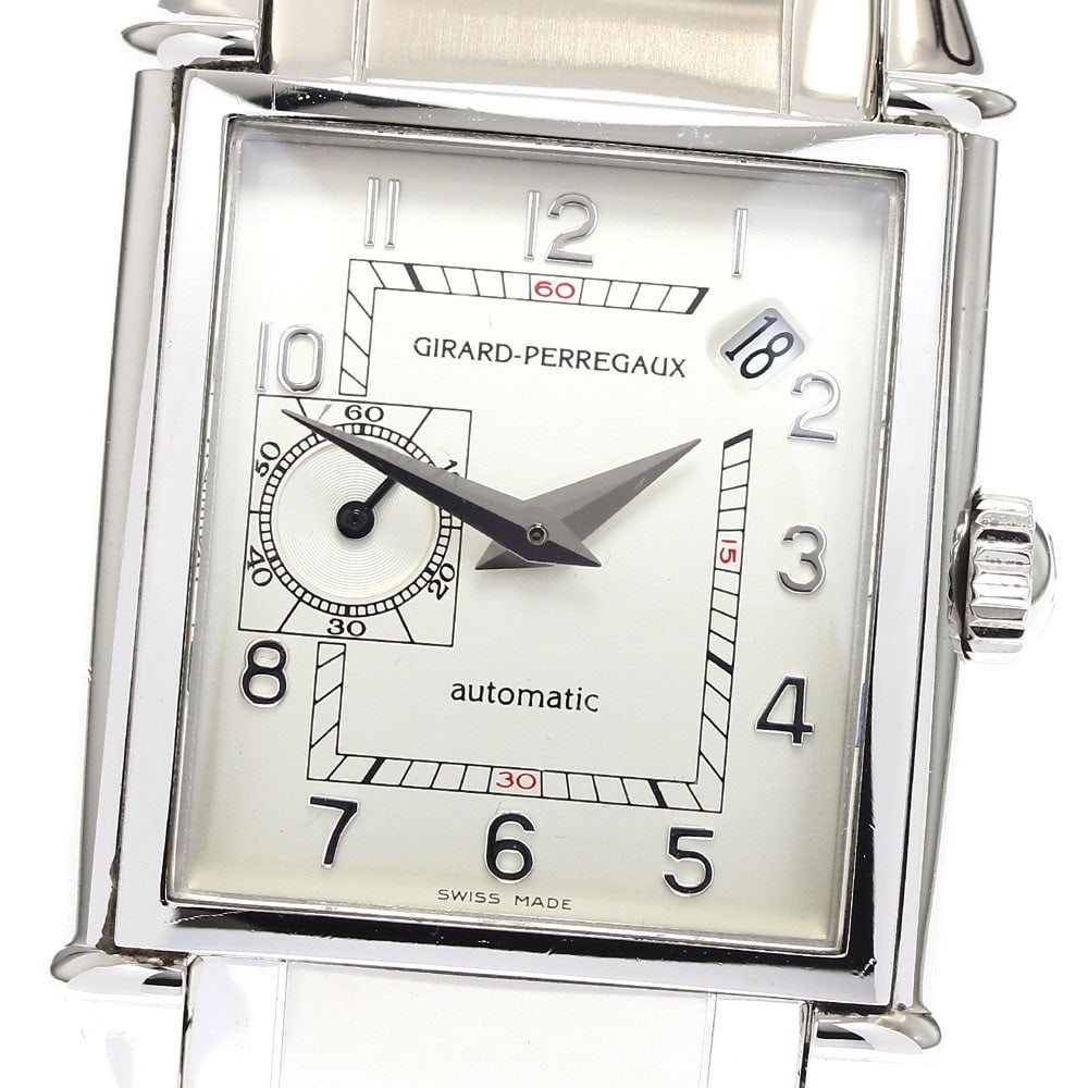 Girard Perregaux Vintage 1945 stainless steel automatic watch: Girard Perregaux Vintage 1945 stainless steel automatic watch This Girard Perregaux Vintage 1945 men's wristwatch features a stainless steel case and bracelet, complemented by a silver dial. The watch