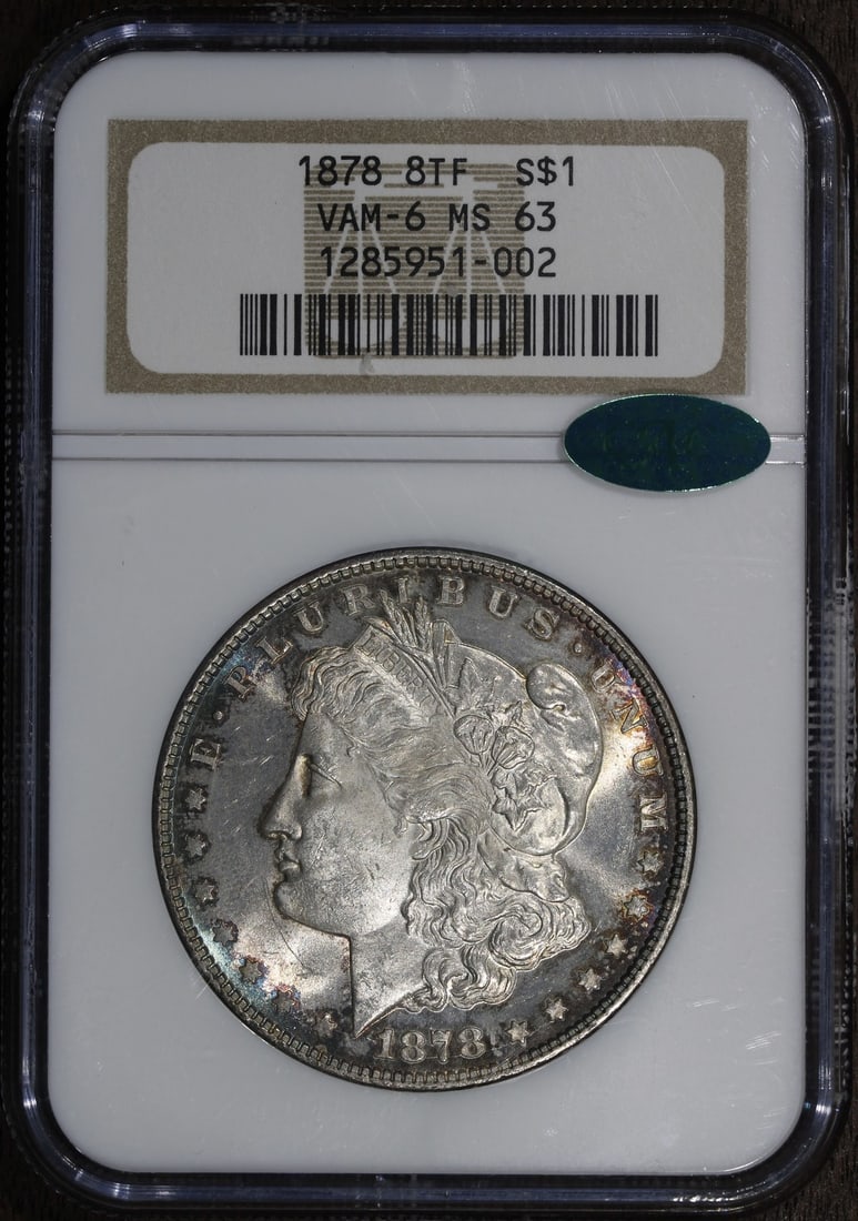 1878 Morgan Silver Dollar MS63 CAC NGC 8 Tailfeathers: 1878 Morgan Silver Dollar MS63 CAC NGC 8 Tailfeathers This 1878 Morgan Silver Dollar is a stunning example of numismatic excellence. Graded MS63 by NGC, this uncirculated coin features a composition o