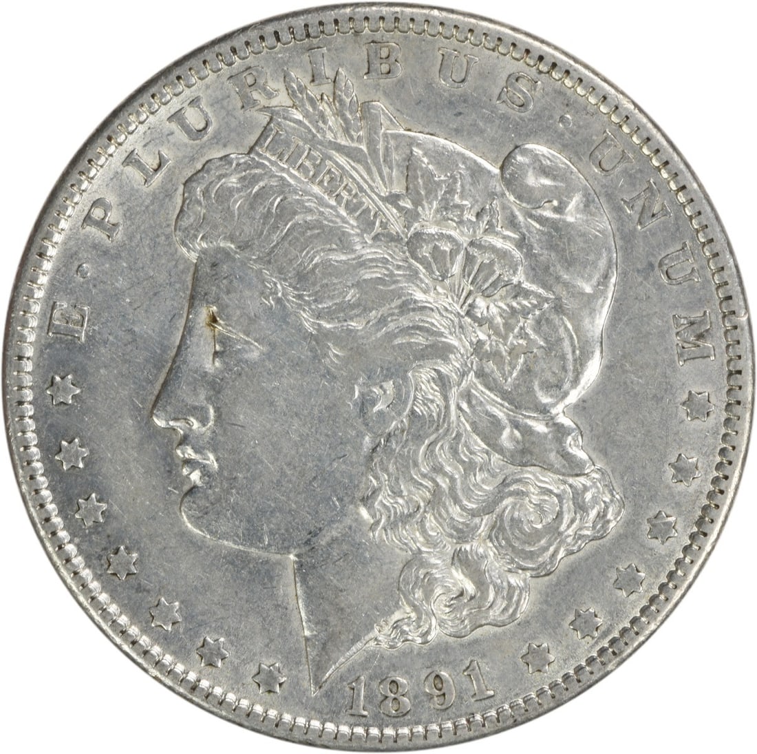 1891 Morgan Silver Dollar AU Uncertified 90% Silver Coin: 1891 Morgan Silver Dollar AU Uncertified 90% Silver Coin This 1891 Morgan Silver Dollar is a beautiful example of American coinage, featuring a striking design by George T. Morgan. The coin is in AU (